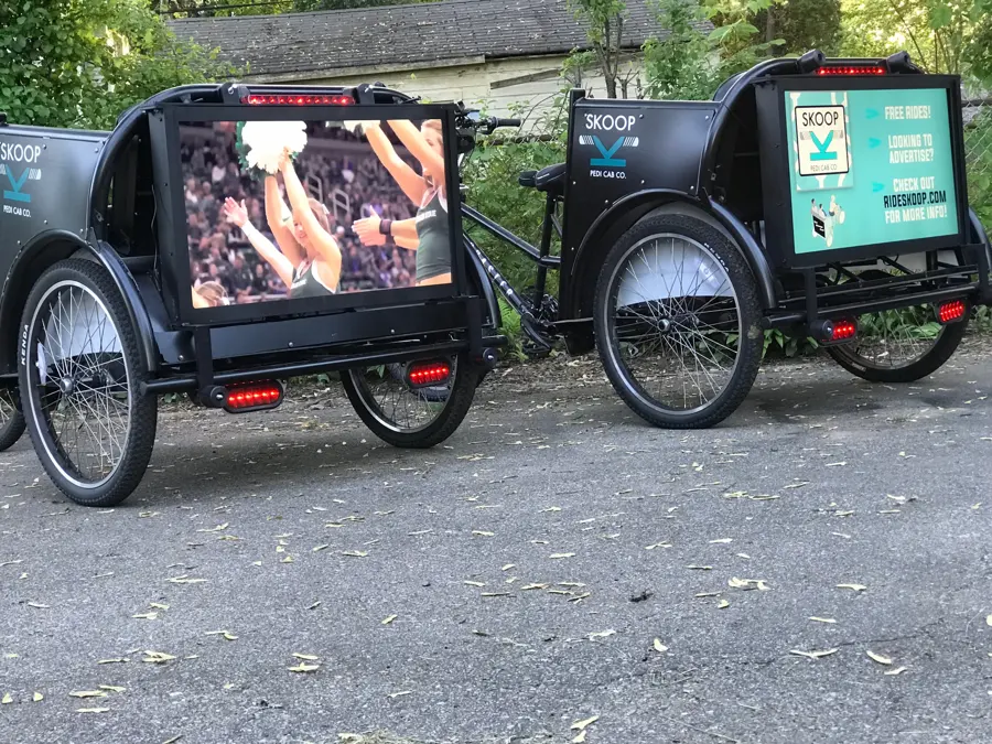 Skoop pedicabs with rear ad screens